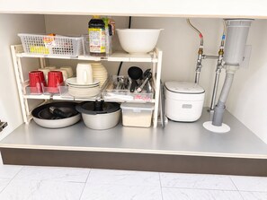 A kitchen area with storage shelves, a rice cooker, and a water filtration system. - Easy Access to Shinjuku , Shibuya Area , 4 Guests , Studio (Shibuya honmachi)