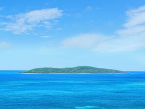 A tropical island with clear blue waters and a lush green landscape. - Crucian Sunsets-Amazing sea views, resort pool, 3bd/2ba Coakley Bay Condo. (Christiansted)