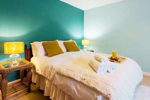 Inviting and bright, this double bedroom is perfect for couples seeking comfort and quiet after busy days exploring.