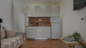 Comfort Suite Ground Floor | Living area | 32-inch Smart TV with satellite channels