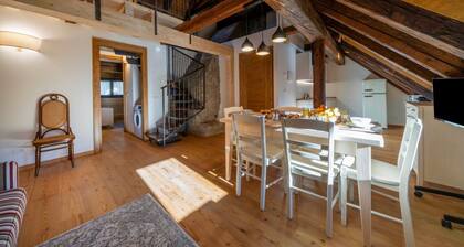 A comfortable 94 square meters apartment, perfect for seven people, located on the second floor of a historic building dating back to 1864 and renovated in 2025 while maintaining its historic atmosphere (NO elevator).The property is located on Tarvisio's