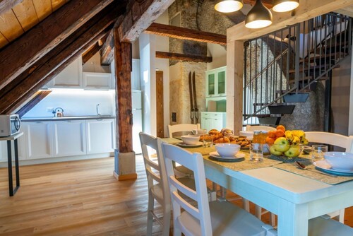 A comfortable 102 square meters apartment, perfect for seven people, located on the second floor of a historic building dating back to 1864 and renovated in 2025 while maintaining its historic atmosphere (NO elevator).The property is located on Tarvisio'
