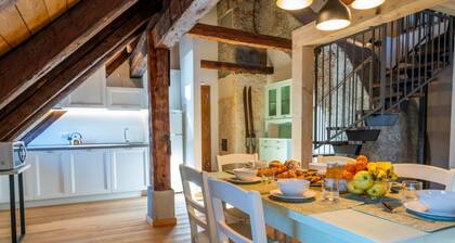 A comfortable 102 square meters apartment, perfect for seven people, located on the second floor of a historic building dating back to 1864 and renovated in 2025 while maintaining its historic atmosphere (NO elevator).The property is located on Tarvisio'