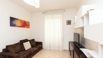 Apartamento | Área de estar | TV 40 polegadas com canais digitais