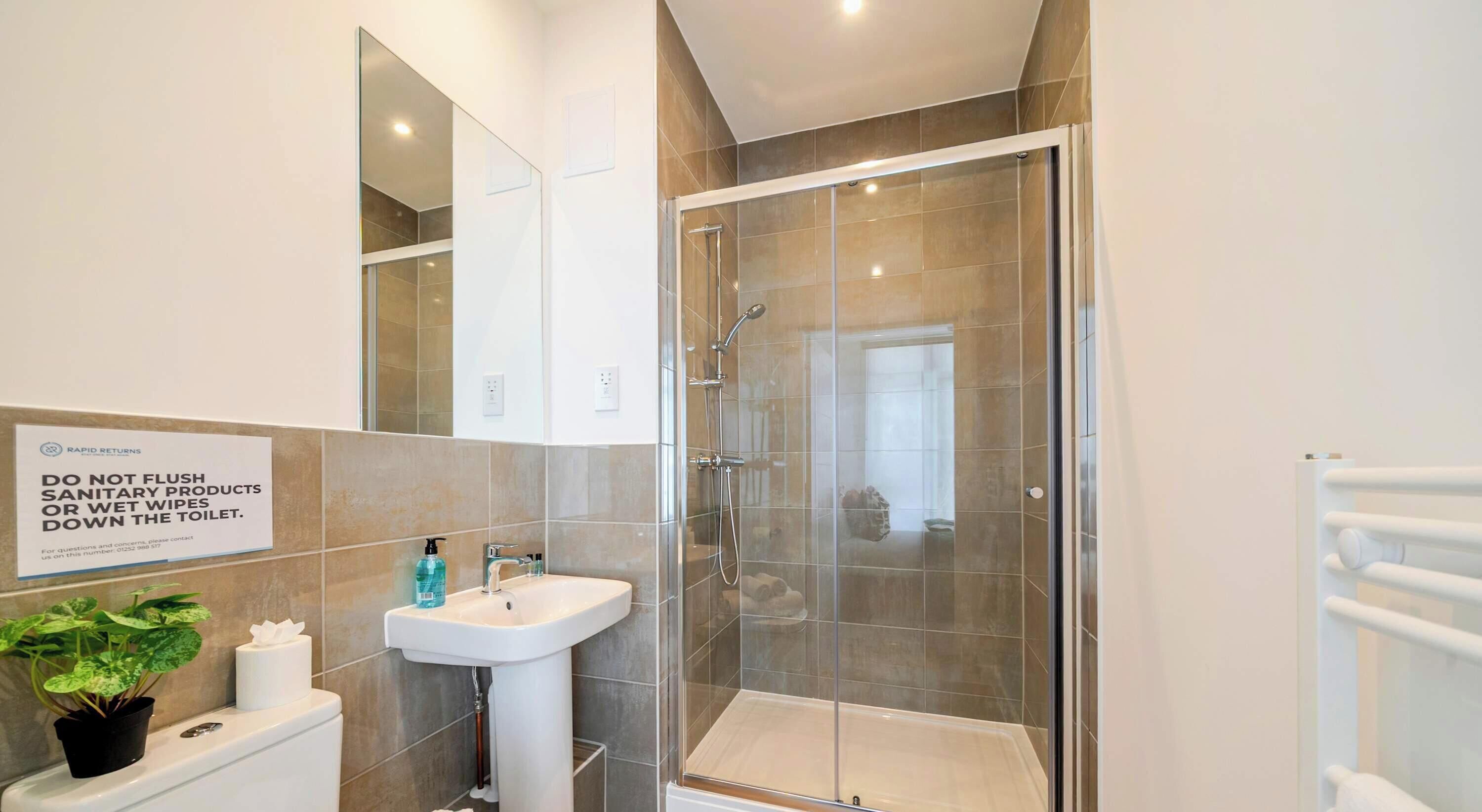 Shower, hair dryer, towels, shampoo