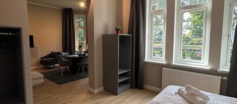 Shore residence: old building jewel on the coastal canal with terrace & garden