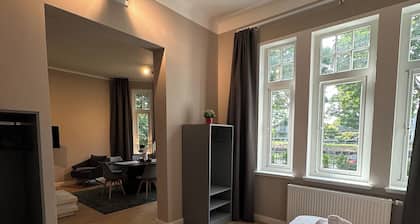 Shore residence: old building jewel on the coastal canal with terrace & garden