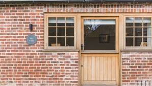 A brick building with a wooden door and windows. - The Stable, Preston, Kent (Preston)