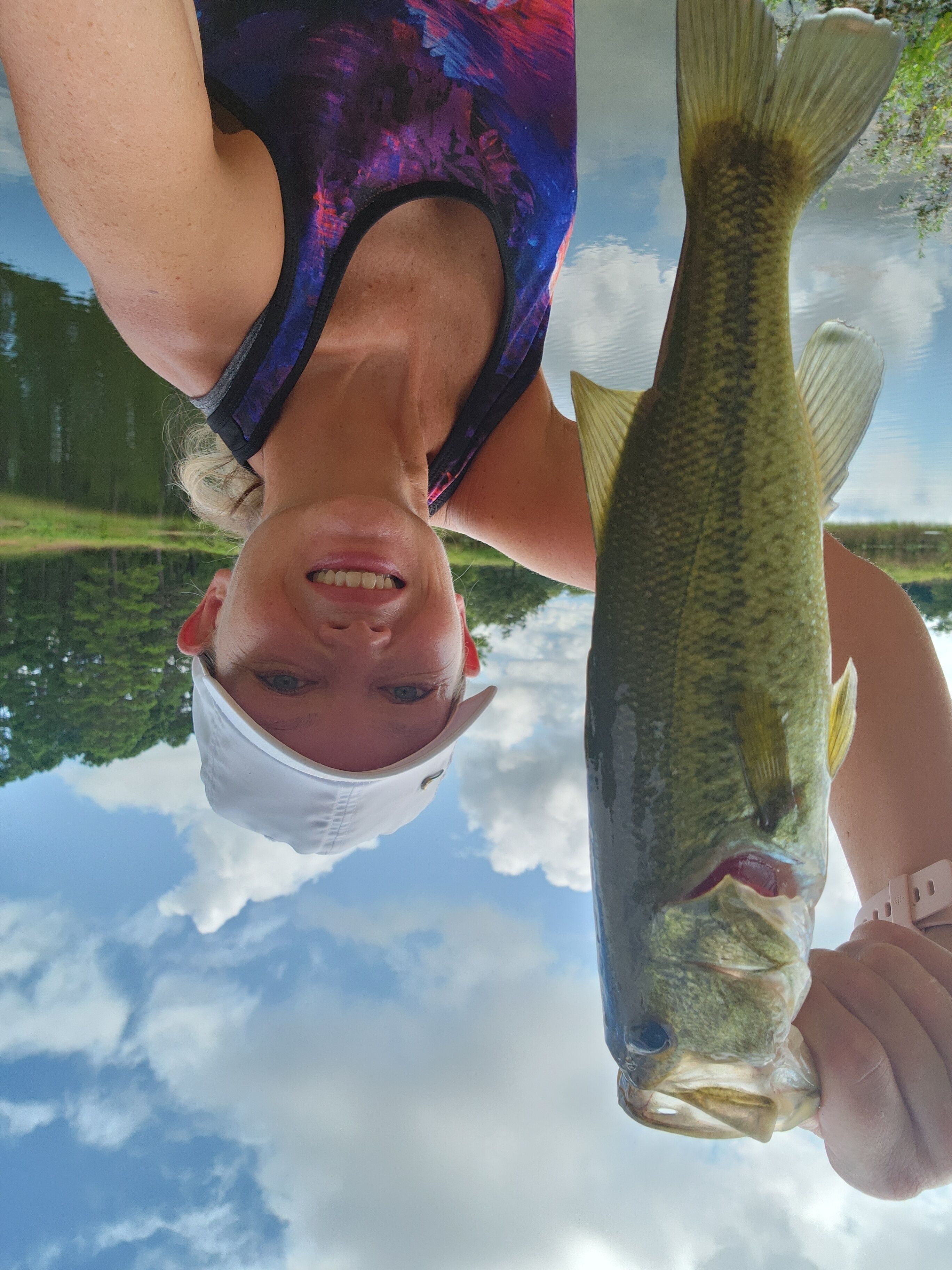A person holding a fish.