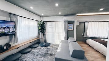 Family Apartment, Balcony | Living area | TV