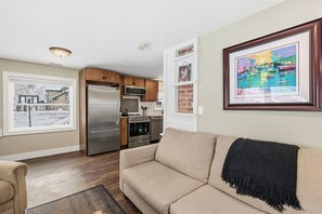 House, Multiple Beds, Patio, Garden View (855 N Grant Ave) | Living area | Fireplace - Kanons Kottage Downtown Retreat Near Rmnp (Loveland)