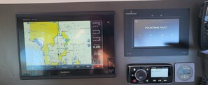 A Garmin GPS device with a map display, a Foursquare app interface, and a radio tuner. - 
NEW LISTING Welcome aboard our luxurious 50' Fountaine Pajot Saba 50 Catamaran (Key West)
