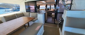 A compact galley with a dining area, kitchenette, and a view of the sea. - 
NEW LISTING Welcome aboard our luxurious 50' Fountaine Pajot Saba 50 Catamaran (Key West)