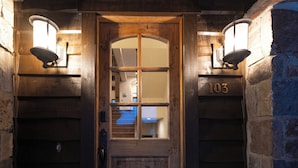 A wooden door with a glass panel and the number 103. - Luxury at Whitefish Mountain chalet w/ hot tub (Whitefish)