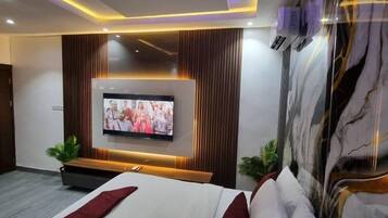 Deluxe Room, Balcony, City View | Desk, laptop workspace, blackout curtains, soundproofing