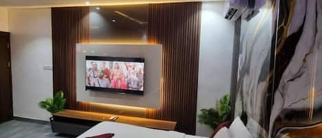 Deluxe Room, Balcony, City View | Desk, laptop workspace, blackout curtains, soundproofing