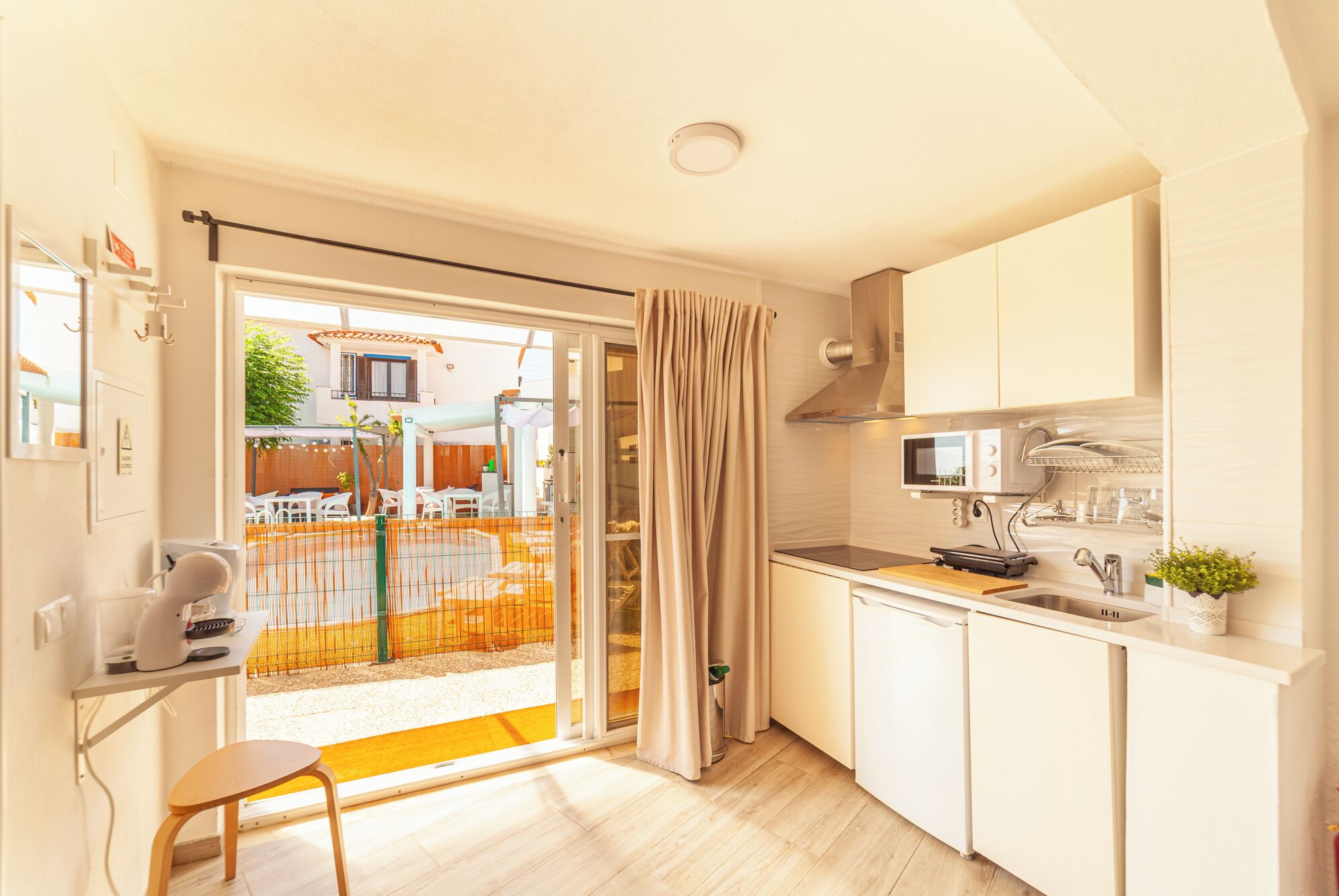 Fridge, microwave, stovetop, coffee/tea maker