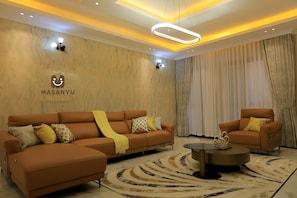 Apartment, 2 Bedrooms | Living area | 65-inch Smart TV with digital channels, DVD player, pay movies