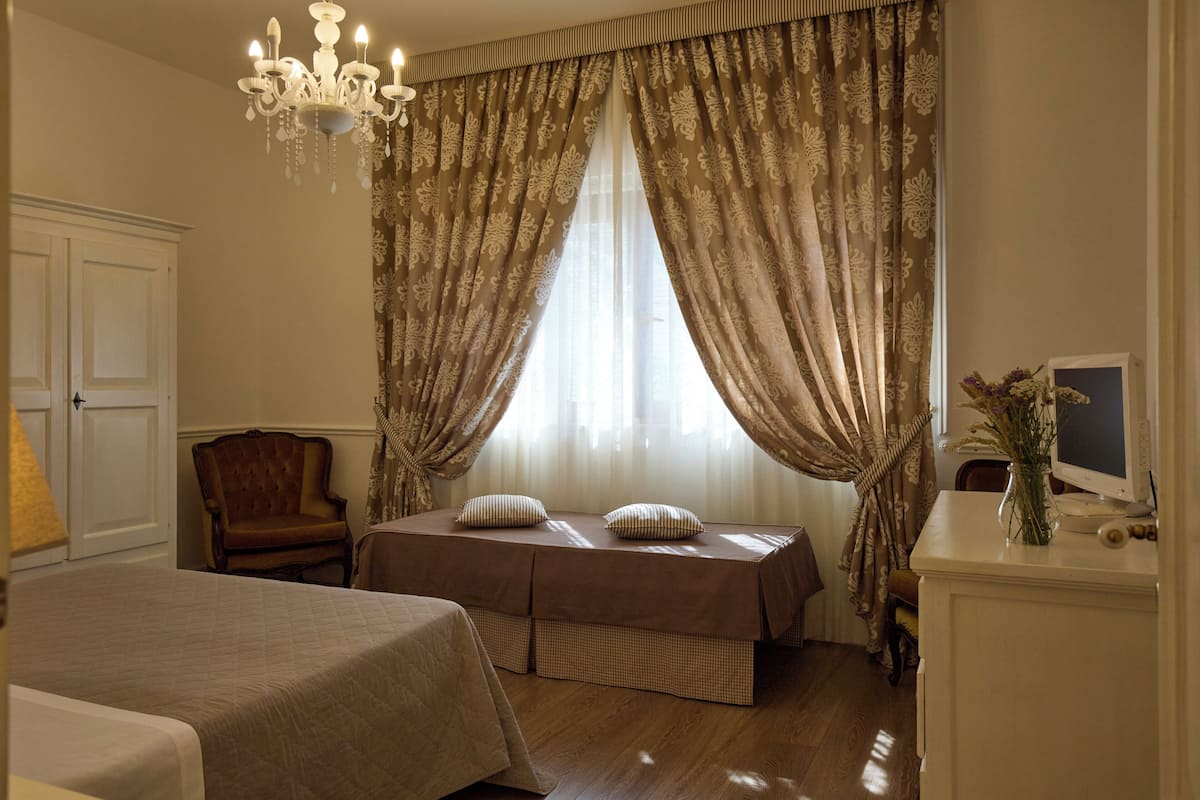 Superior Triple Room, City View | Blackout drapes, iron/ironing board (on request), WiFi (free)