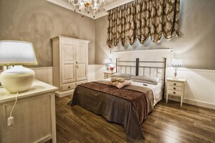 Habitación triple Deluxe | Cocina privada | Trona infantil