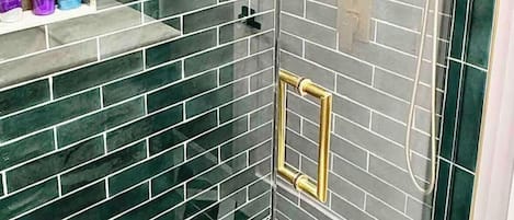 Shower, hair dryer, towels, shampoo