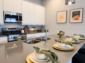 Fridge, microwave, oven, stovetop - RR7740-145SRD -  3BR Luxury Condo • Reunion Resort (Kissimmee)