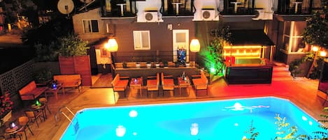 Seasonal outdoor pool, pool umbrellas, pool loungers