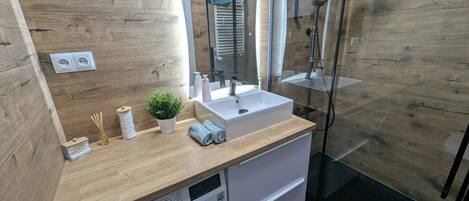 Shower, hair dryer, towels, soap