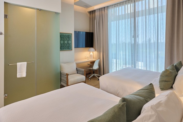 Deluxe Room, 2 Queen Beds, Non Smoking | Minibar, in-room safe, desk, laptop workspace