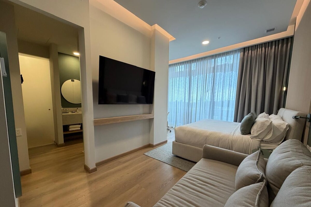 Junior Suite, 1 King Bed, Non Smoking (with Sofabed) | Minibar, in-room safe, desk, laptop workspace