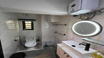 Shower, towels, soap, toilet paper