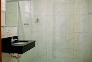 Shower, towels, soap, toilet paper