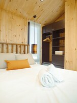 Premium bedding, down comforters, pillowtop beds, minibar
