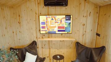 55-inch Smart TV with cable channels, fireplace, Netflix