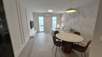 Apartment (One bedroom apartment I) | Living room | 32-inch flat-screen TV with satellite channels
