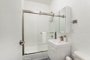 Shower, hair dryer, towels - 444-2E Modern 2BR Hell's Kitchen (New York)