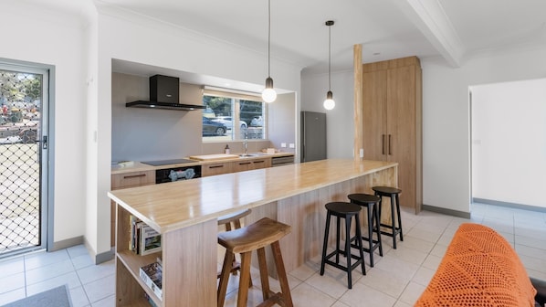Microwave, oven, dishwasher, dining tables