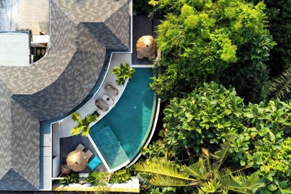 An aerial view of a resort with a swimming pool, lounge area, and lush greenery. - Villa Jungle Rendez Vous by BaliSuperHost (Bali)