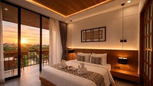 A modern hotel room with a large bed, a view of the sunset, and a balcony. - Omkara Dharman Ubud Villa (Bali)