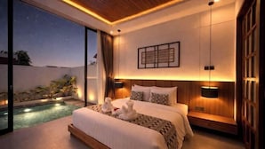 A modern bedroom with a large bed, bedside lamps, a view of the sky, and a small pool. - Omkara Dharman Ubud Villa (Bali)