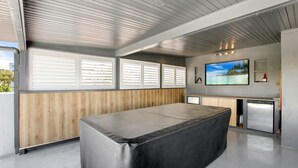 A modern kitchen with a built-in oven, a sink, and a countertop. - Trade Winds Unit 5, 52 Edmund St, Kings Beach (Kings Beach)