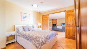 A bedroom with a bed, bedside tables, a lamp, and a framed picture on the wall. - Mountain View Retreat, Year Round Sunshine
1 bed, 1 renovated bath in Boulder (Boulder)