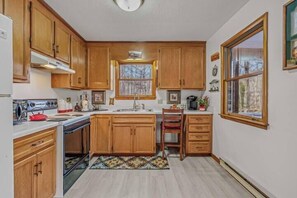 Fridge, microwave, oven, stovetop - Khan River Cabin - Riverfront | Wifi | Firepit | Wood Stove | Screen Porch (Great Cacapon)