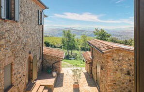 A stone building with a view of a vineyard and hills. - Amazing home in Cinigiano (Cinigiano)