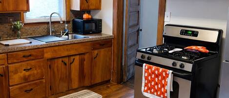 Fridge, microwave, stovetop, coffee/tea maker