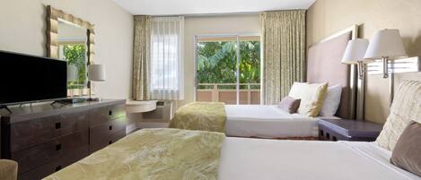 A hotel room with two beds, a flat-screen TV, a dresser, and a window with curtains.