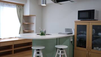 Family Studio, City View | Private kitchen | Mini-fridge, microwave