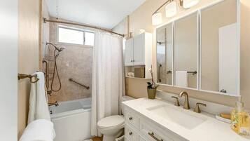 Shower, jetted tub, hair dryer, towels