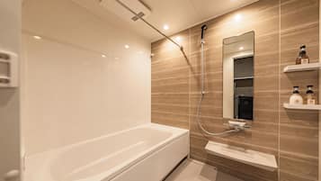 Deluxe Suite, Balcony, City View | Bathroom | Free toiletries, hair dryer, slippers, electronic bidet
