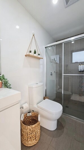 Shower, hair dryer, towels, soap